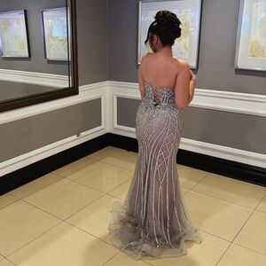 A prom dress. It’s grey with silver details from glamour couture